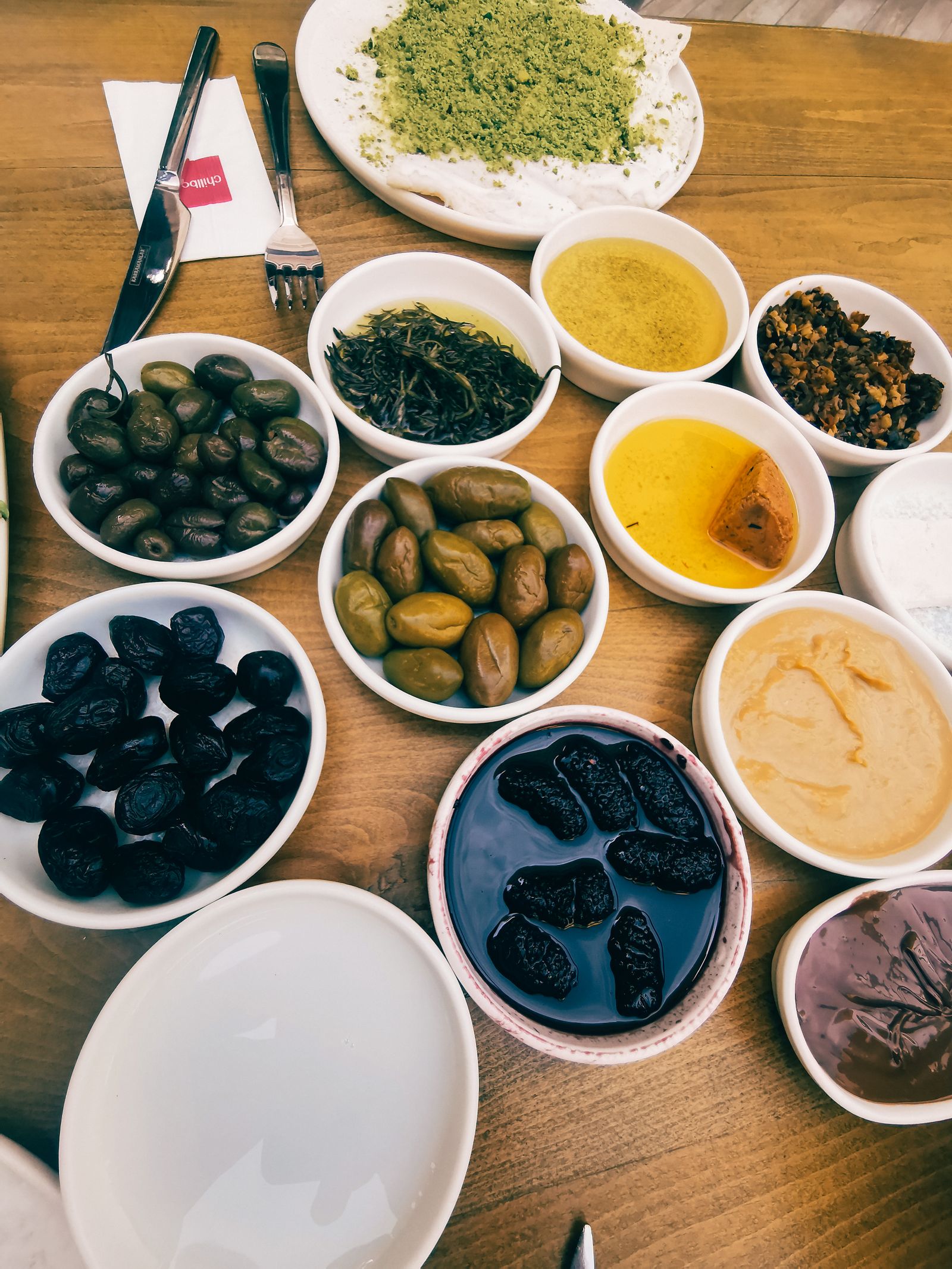 A table laid with many small Cypriot meze plates.