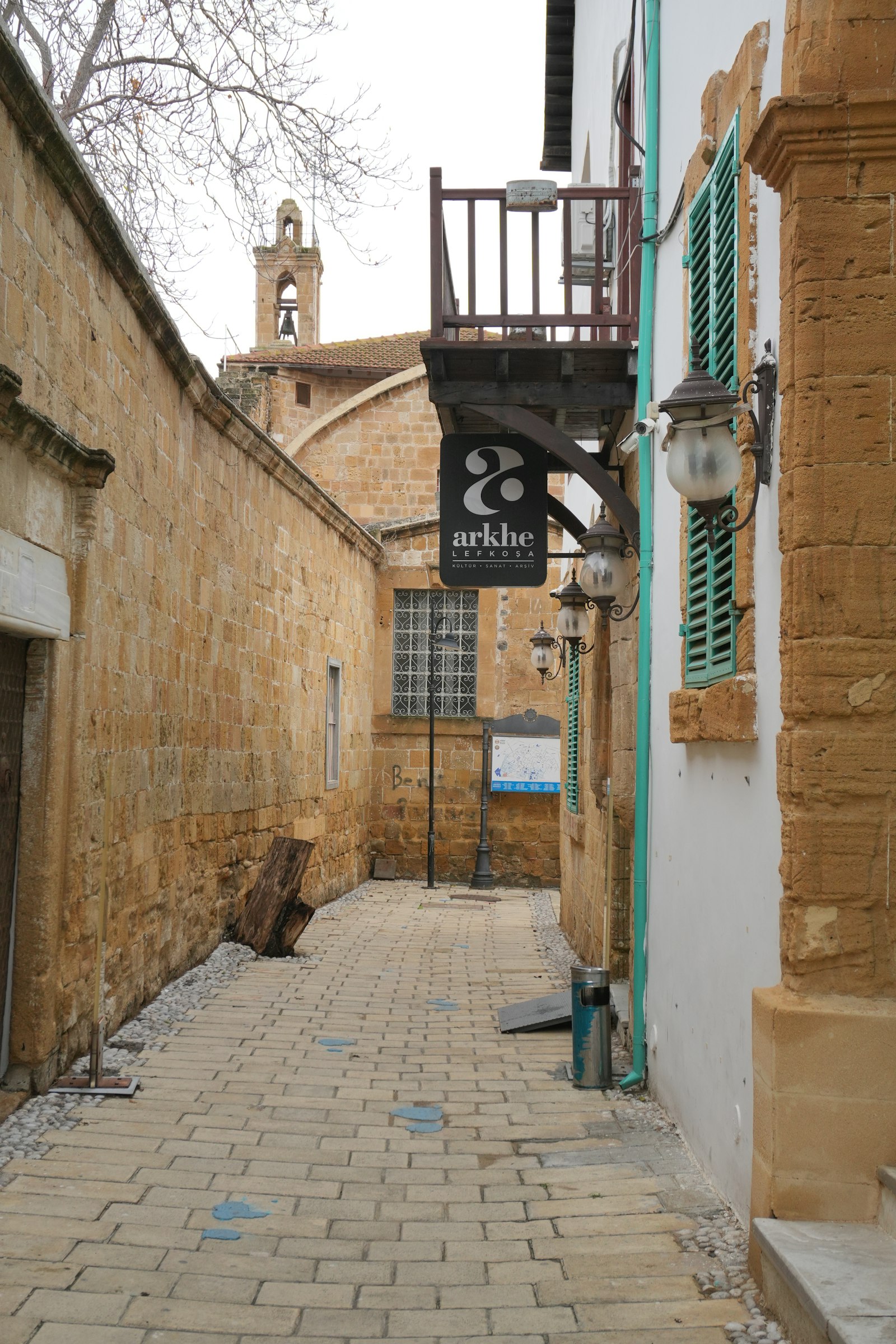 A stone street in the old town at dusk.