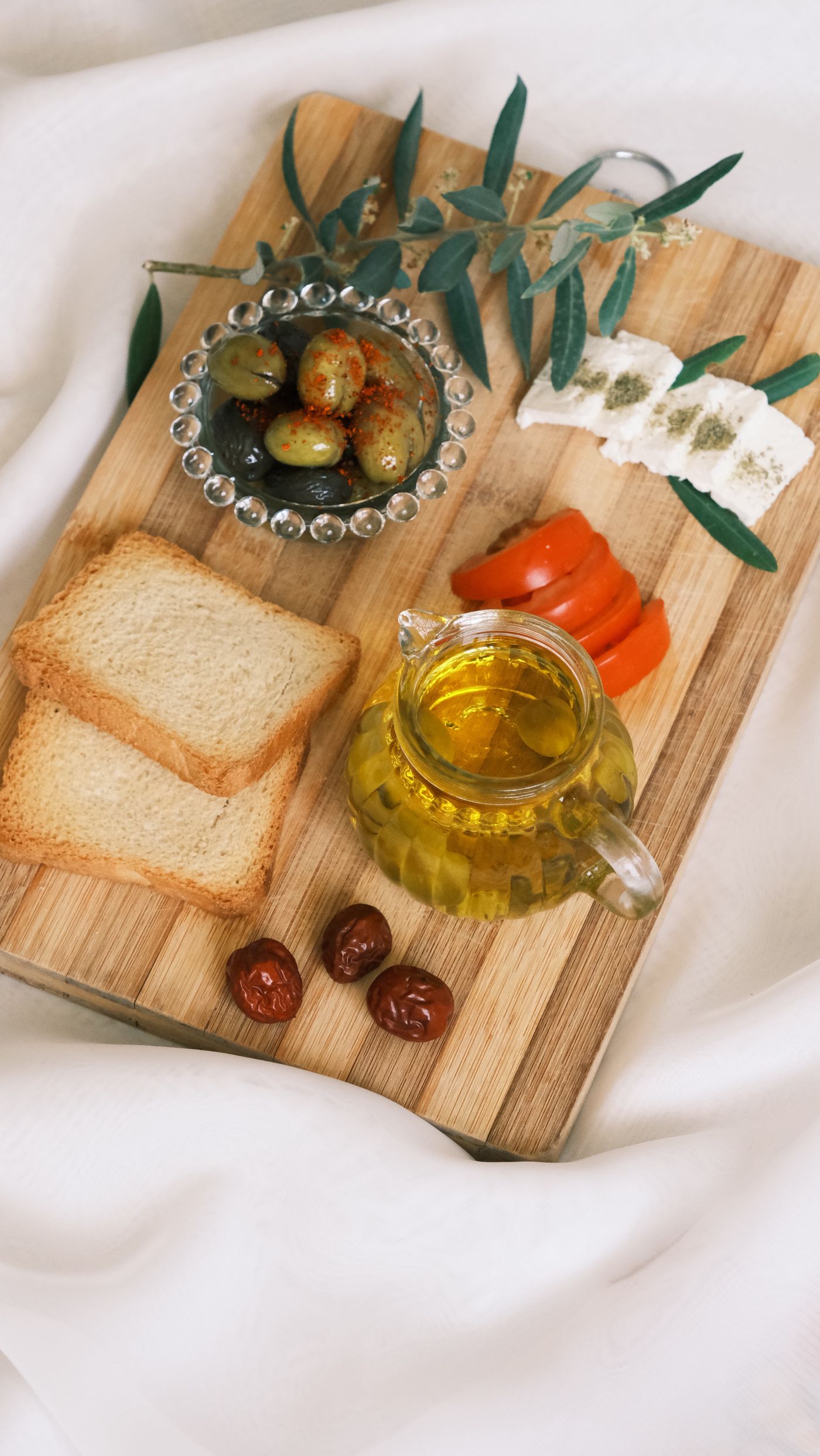 A rustic board of olives, bread and traditional Cypriot starters.